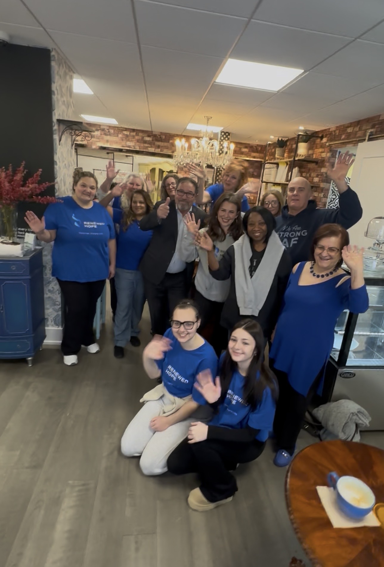 Pat Fortini with the Renewed Hope volunteer team wearing blue Renewed Hope shirts at the Renewed Hope Food Fair