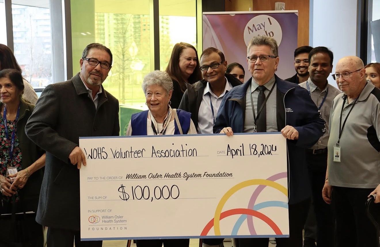 Pat Fortini with a group presenting a $100,000 cheque to the William Osler Health System Foundation